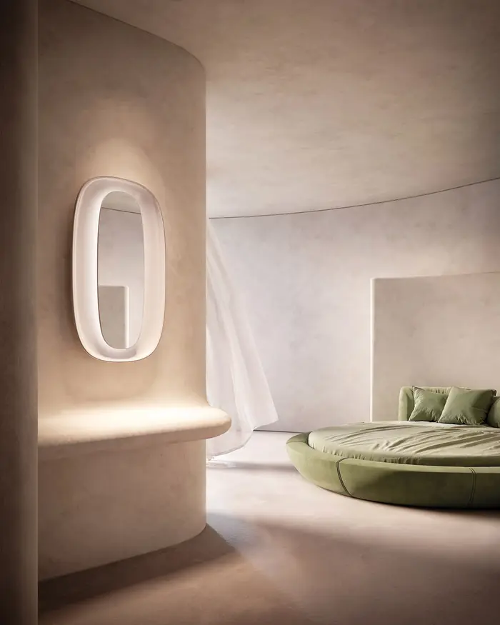 Een ovale lichtgevende wandlamp in een gebogen gestucte wand naast een rond groen ligbed